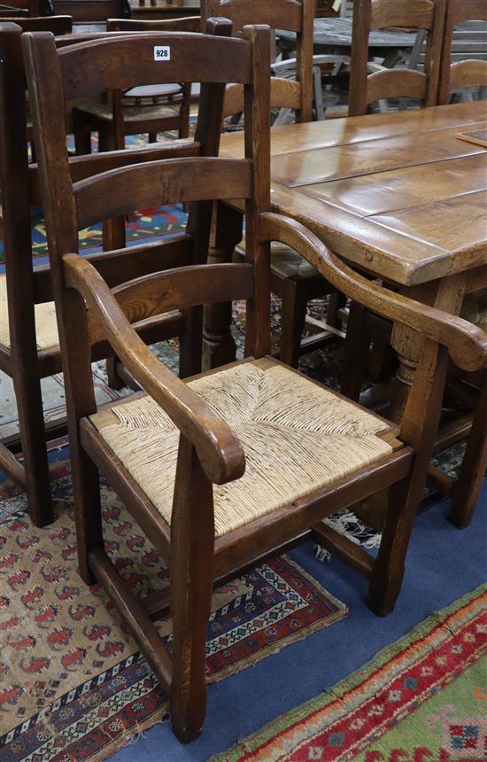 A set of ten 17th century style oak dining chairs (two having arms), with drop-in rush seats